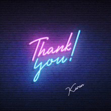 a neon sign that says " thank you " on a brick wall