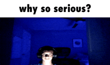 a man wearing headphones in a dark room with the words why so serious