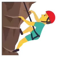 a man wearing a red helmet is climbing a mountain