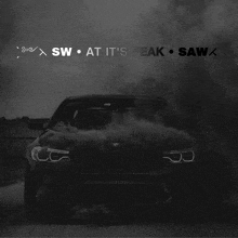 a black bmw with smoke coming out of it and the words sw at it 's peak saw