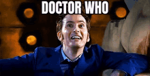 a man in a blue suit and tie is smiling with the words `` doctor who '' written on the bottom .