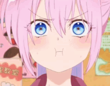 a close up of a pink haired anime girl with blue eyes making a funny face .