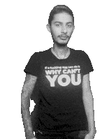 a man wearing a black shirt that says why can t you