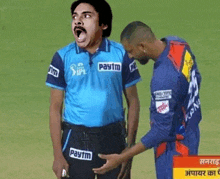 a man wearing a paytm shirt is being touched by another man