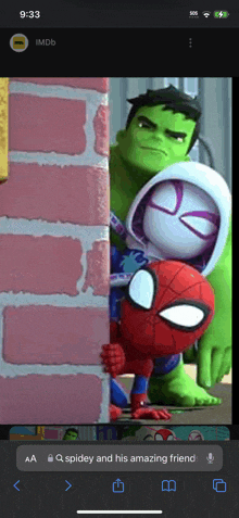 a phone screen shows a picture of spider-man hulk and spider-girl