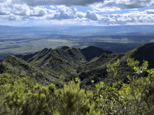 a view of a valley with mountains in the distance