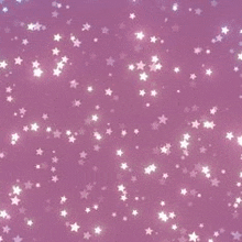 a bunch of white stars are falling on a pink background .