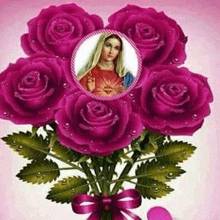 a bouquet of pink roses with a picture of the virgin mary in the middle .