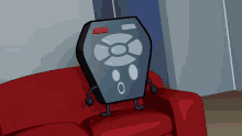 a remote control with arms and legs is sitting on a couch