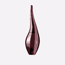 a bottle of perfume has a long neck and looks like a vase