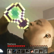 a man is drinking from a pixelated bottle in a video game called moist.exe