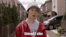 a young man wearing a red jacket and a hat says we feelin that shing02 vibe