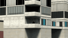 a man stands on a balcony of a building with many windows