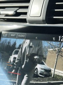 a car dashboard with a screen that says map audio