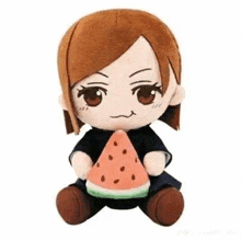 a stuffed animal of a girl is holding a slice of watermelon .