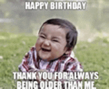 a baby is laying in the grass with a happy birthday meme on it .