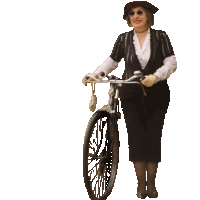 a woman wearing a hat and sunglasses is standing next to a bike