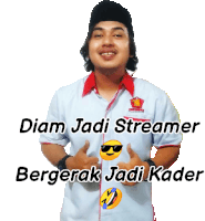 a man wearing a shirt that says ' diam jadi streamer bergerak jadi kader '