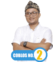 a man with his arms crossed and a blue button that says coblos no. 2