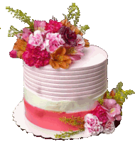 a cake with pink and white frosting and flowers on top