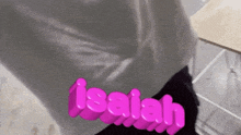 the word isaiah is written in pink letters