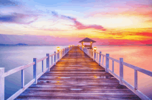 a wooden pier with a gazebo at the end