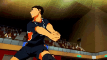 a man in a volleyball uniform is jumping in the air while playing volleyball in a stadium .