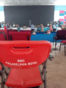 a red chair that says bwc philadelphia royal