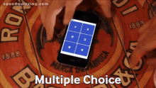 a person is playing a game on a cell phone with the words multiple choice written on the bottom