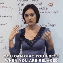 a woman stands in front of a white board with the words " you can give your best when you are relaxed " below her