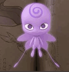 a purple octopus with a spiral on its head is sitting on top of a book .