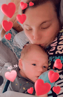 a woman is kissing a baby on the cheek with hearts around them and the date jul 19