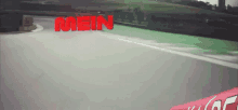 the word mein is displayed in red on a road