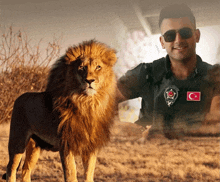 a man wearing sunglasses stands next to a lion with a turkey flag patch