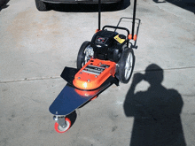 a lawn mower with a tag on it that says ' gx ' on it