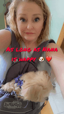 a woman holding a small dog in a sling with the words as long as nana is happy