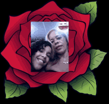 two women are posing for a picture in front of a rose