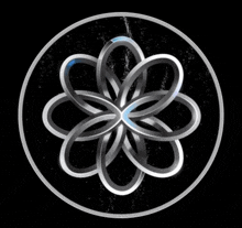 a silver circle with a flower in the center