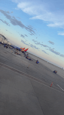 a row of southwest airlines planes are parked at an airport