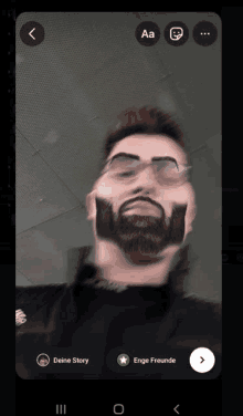 a picture of a man with a beard and glasses is being edited on a phone