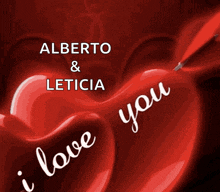 a red heart with the words " alberto & leticia " written on it