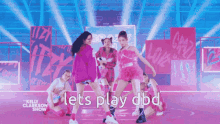 a group of girls are dancing on a stage with the words let 's play dbd