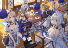 a group of maids are standing around a table in a cafe