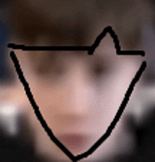 a close up of a person 's face with a triangle in the middle