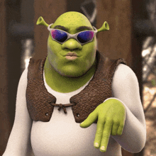 shrek is wearing sunglasses and pointing his finger at the camera