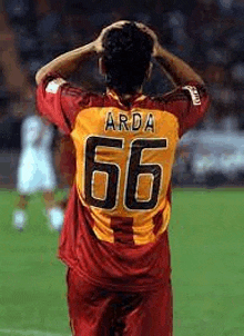 a soccer player with the number 66 on his back