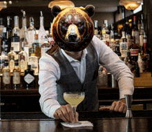 a bartender with a bear mask on his head