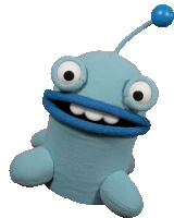 a blue stuffed toy with big eyes and a blue antenna