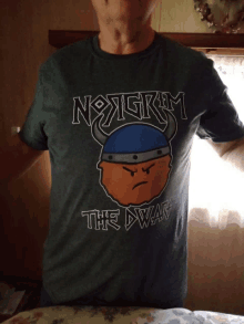 a man is wearing a t-shirt that says nogrim the dwarf on it