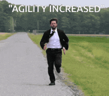 a man in a suit and tie is running down a road with the words " agility increased " behind him